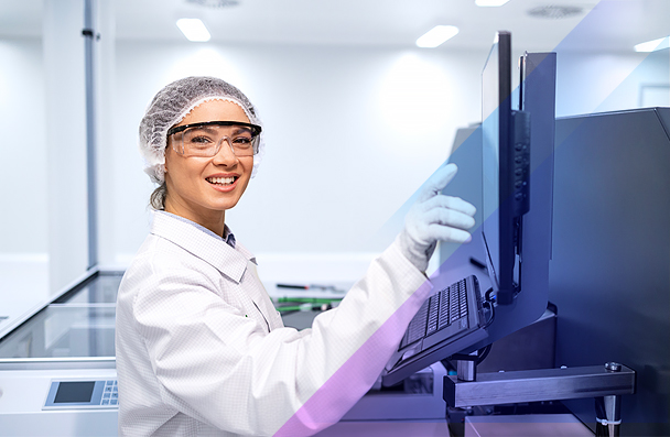 Technician working with equipment in a Lumentum cleanroom